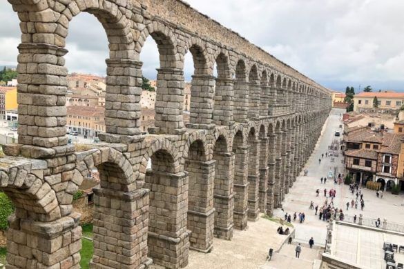 Roman aqueduct in Segovia is the most iconic attraction on a day trip, one day in Segovia Spain must see tourist site