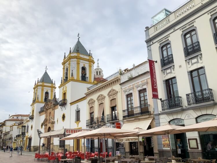Plaza Mayor in Ronda with restaurants and a cathedral