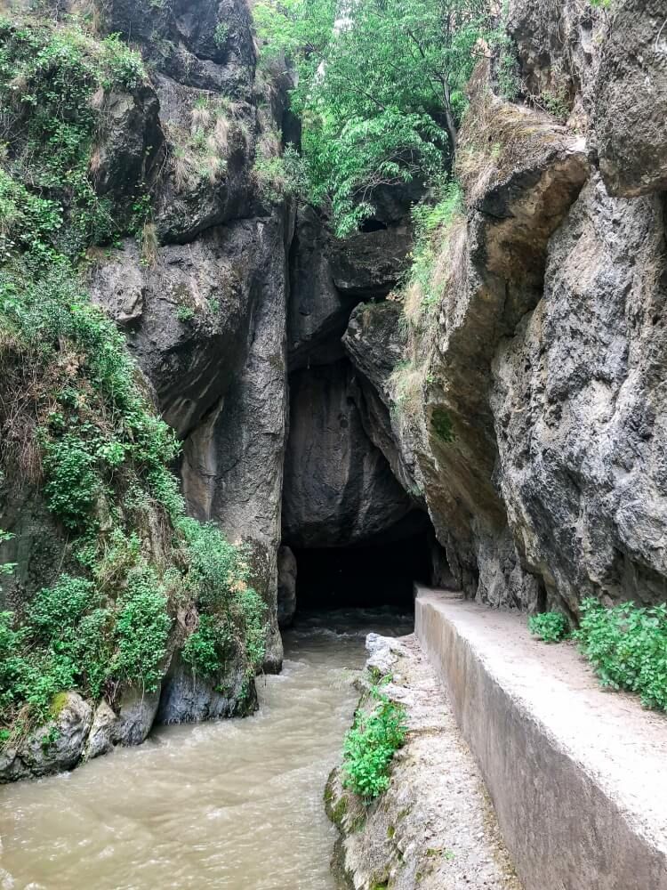 mysterious cave on trail in Sierra Nevada