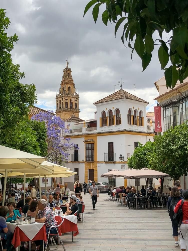 pretty streets in Cordoba with Mezquita in background