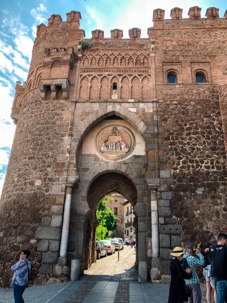 Old stone gate during a walking tour on a day trip to Toledo