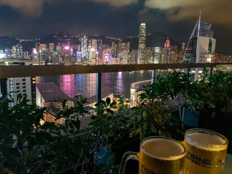 lights reflecting into the water over Hong Kong