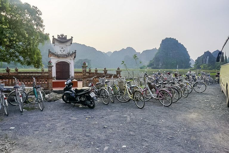 Loads of bicycles and some mopeds entrance to Mua Cave viewpoint
