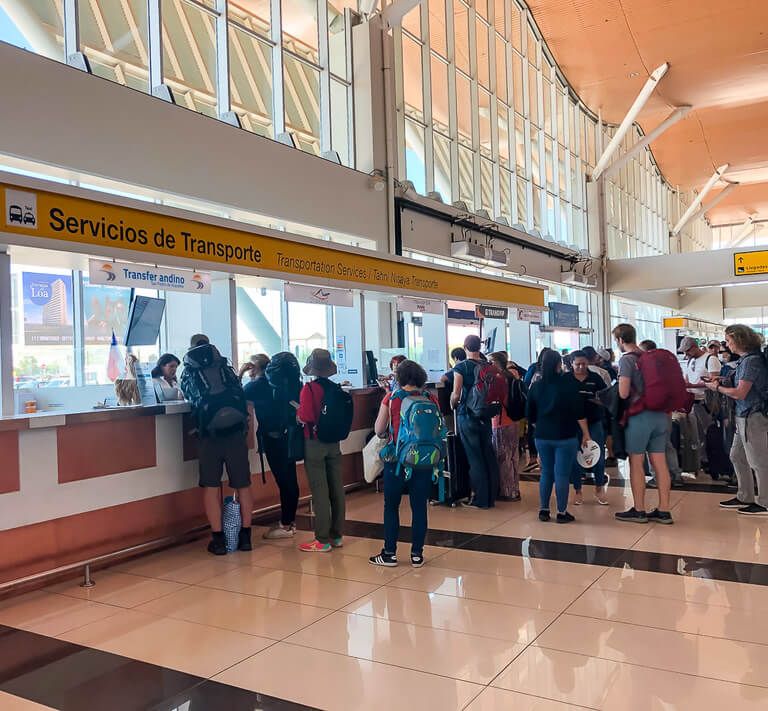 line for bus tickets inside Calama Airport start of San Pedro de atacama itinerary