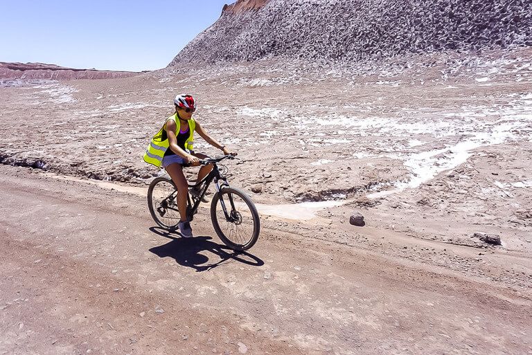 kristen carefully riding her bike through valle de la luna