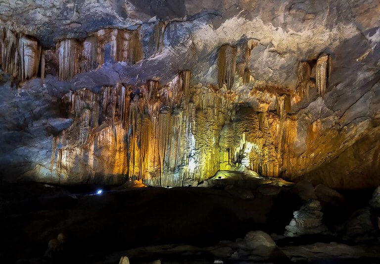lights illuminating rocks inside paradise cave things to do in Phong Nha