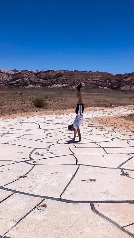mark trying a handstand on cracked salt mud in atacama