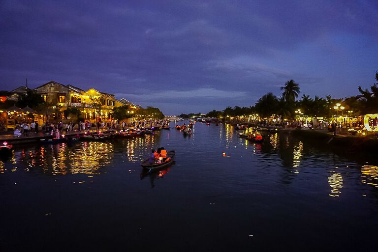 Boats on river Hoi An itinerary at night banks lit up