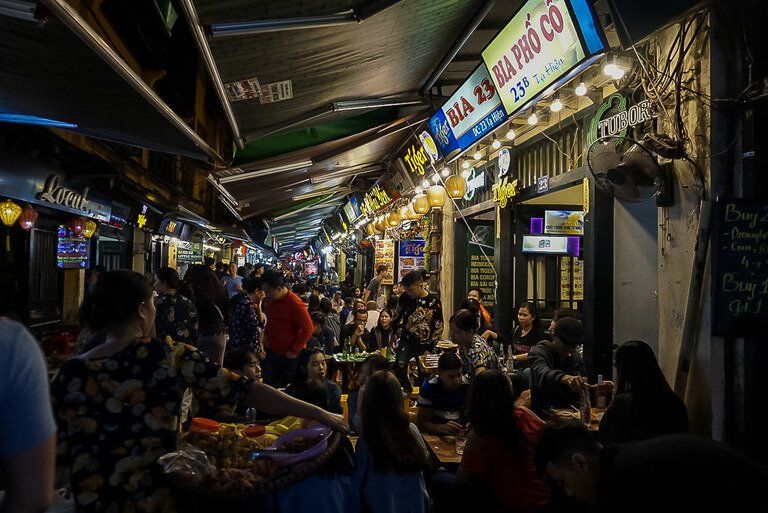 Ta Hien beer street in hanoi crowded with tourists drinking beers