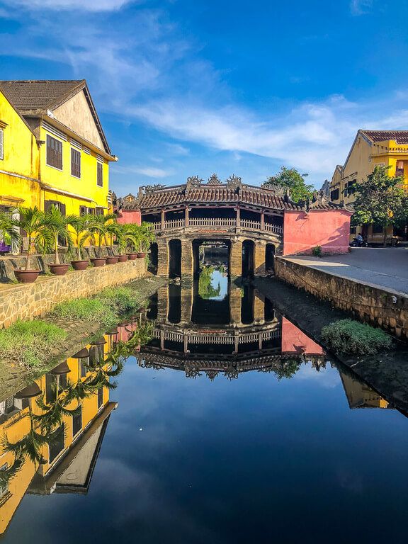 Stunning Japanese bridge reflecting off water in Hoi An itinerary vietnam