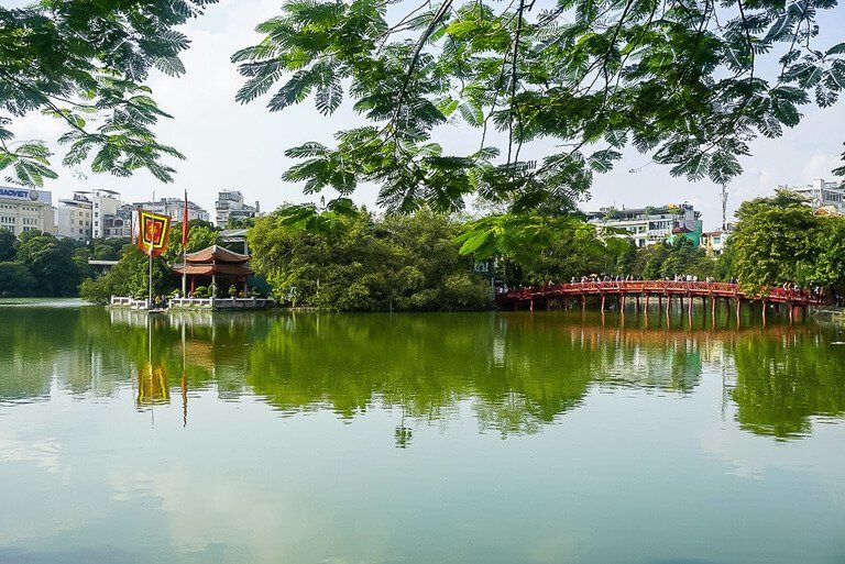 Bridge of rising sun to jade island and Ngoc son pagoda Hoan Kiem lake Vietnam