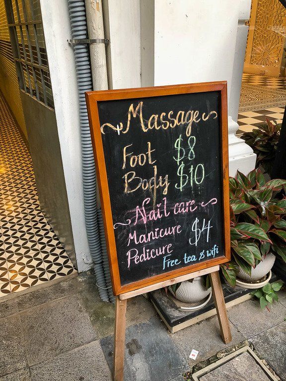 Massage parlor blackboard sign with prices