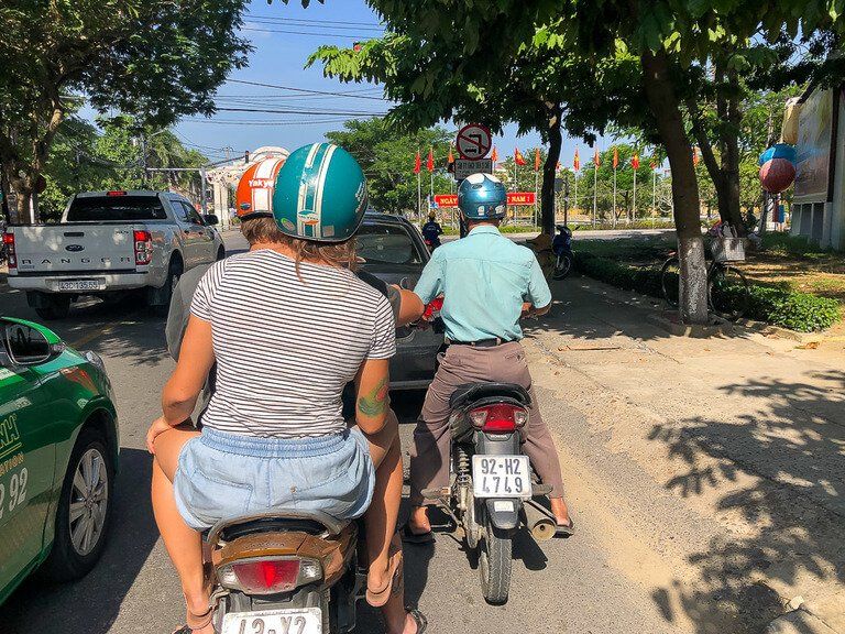 Motorbikes and cars on road in vietnam