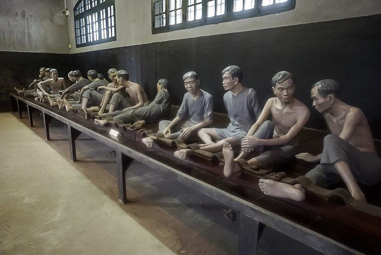 Hanoi itinerary Hoa Lo Prison French quarter men on bench exhibit