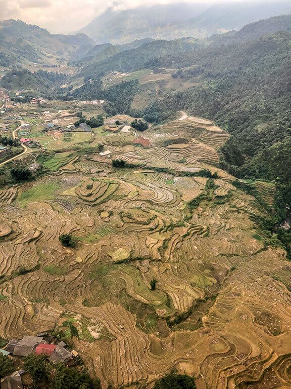 Brown muddy waterlogged rice paddy terraces view from cable car sapa itinerary vietnam