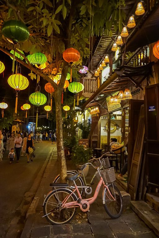 Hoi An ancient town lanterns and pink bicycle