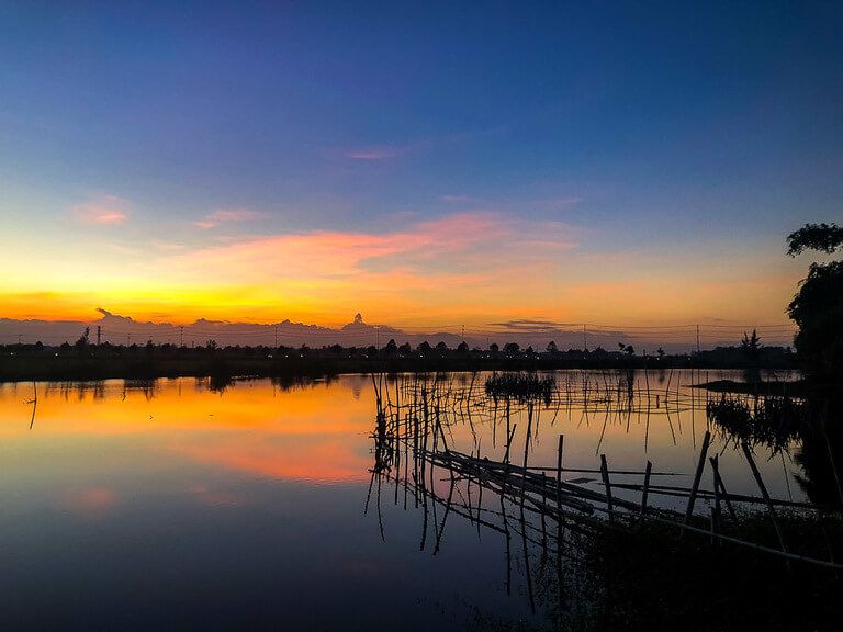 Gorgeous colors in sky sunset in Hoi An vietnam over river