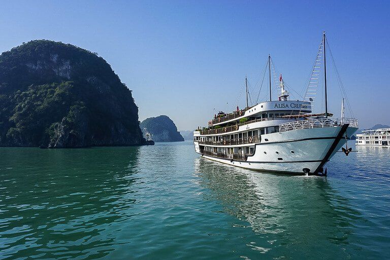 Cruise ship on turquoise water in Halong bay