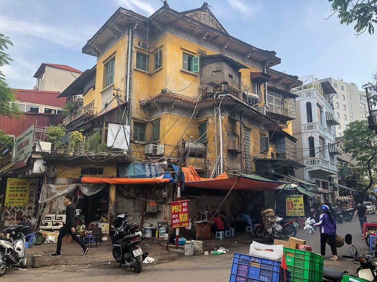 why 2 days is enough in Hanoi rundown buildings and junk scattered