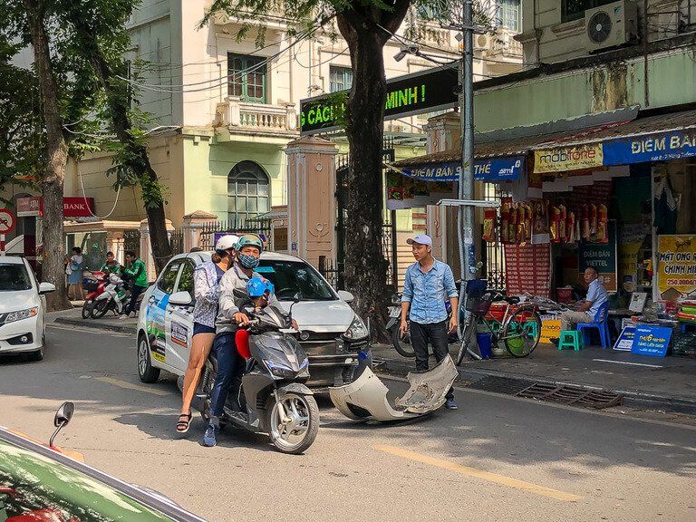 Car and motorbike collision and argument in street