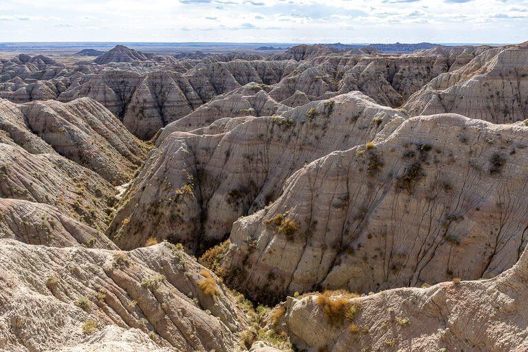 Badlands national park is an incredible alien landscape just over an hour from mt rushmore and one of the best things to do near Mount Rushmore on a South Dakota road trip itinerary