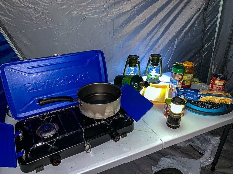 Cooking gear and lights inside tent sage creek campground badlands