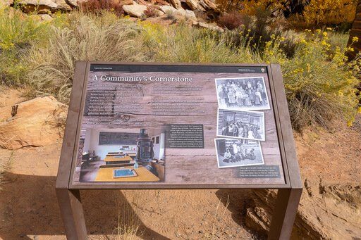 sign showing history of fruita schoolhouse capitol reef