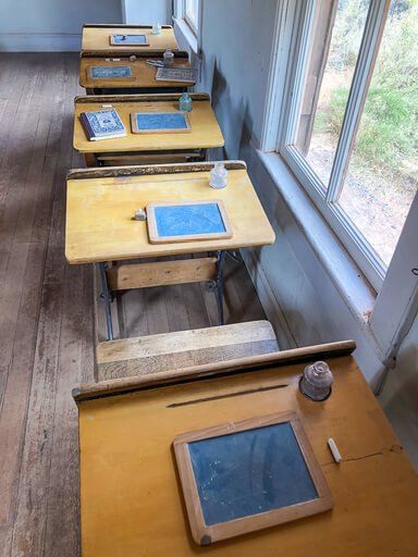 Old wooden desks inside fruita schoolhouse Capitol Reef