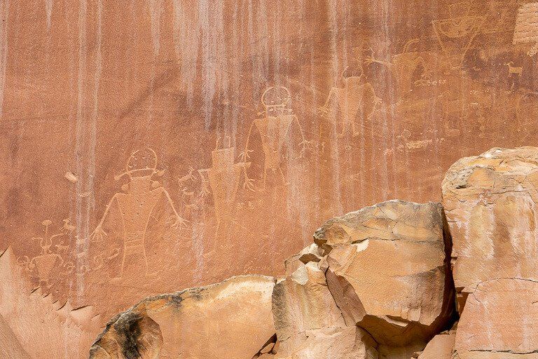 Fremont petroglyphs carved into a rock face in Capitol Reef national park