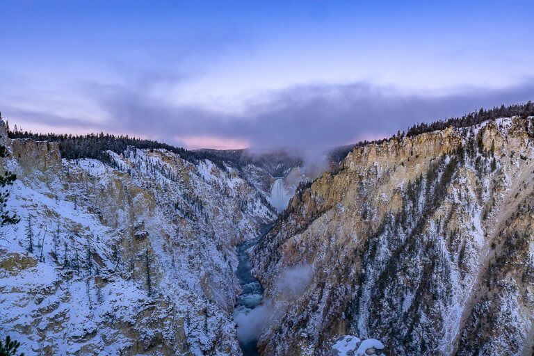 Awesome sunrise purple pink sky over Yellowstone lower falls national park