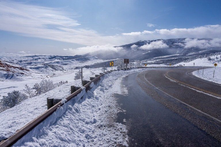 Road into Yellowstone northeast entrance US-212 covered in snow after heavy snowfall October