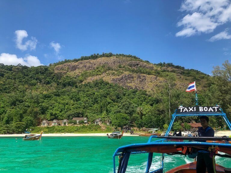 Koh Adang viewpoint seen from the taxi long tail boat on the sea