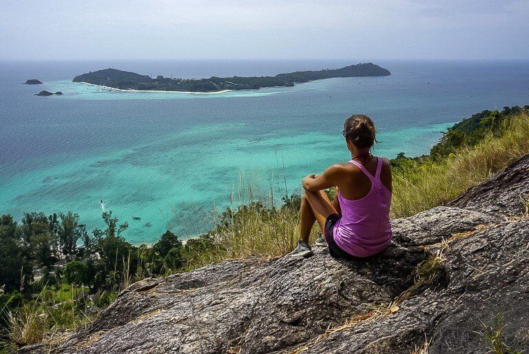 Kristen sat at the Koh Adang viewpoint overlooking Koh Lipe island shows the small size of Koh Lipe