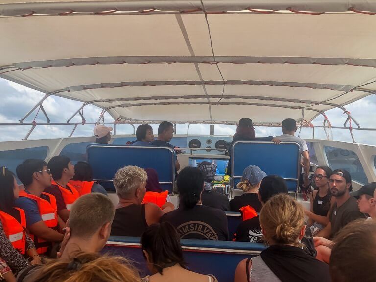 Packed speedboat full of tourists in Thailand