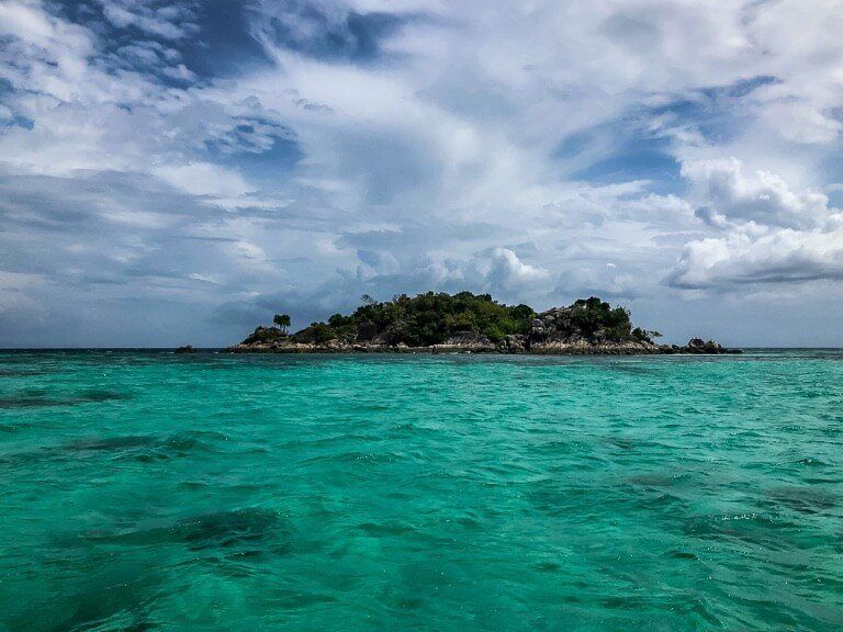 Small island on turquoise waters near Koh Lipe Thailand