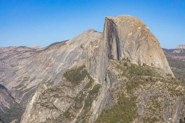 Close up zoomed in half dome looking amazing against a blue sky