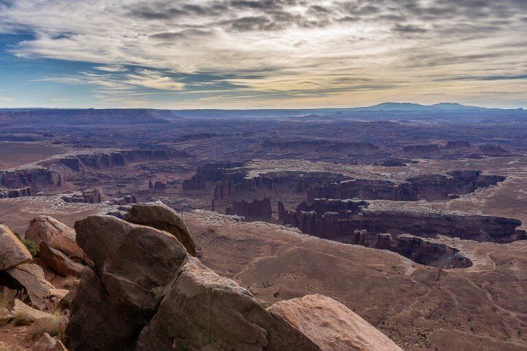 Deep ravines and gorges in a wide open landscape with clouds in the sky