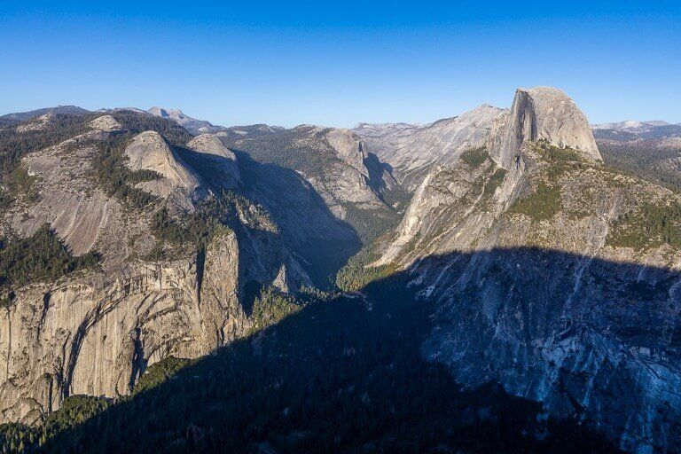 Half Dome almost covered by a huge shadow in late afternoon