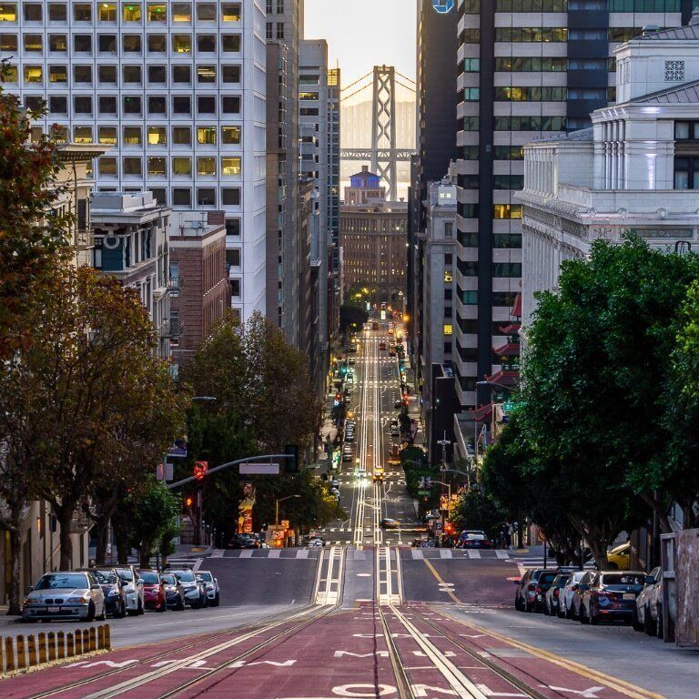 Spectacular san Francisco photography location california & powell intersection view of tram line and Oakland bridge in background