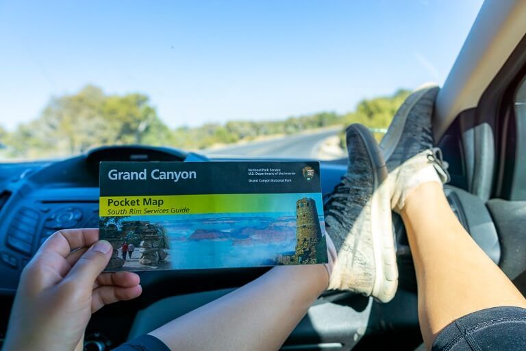 Entrance fee and parking at Grand Canyon south rim kristen holding NPS map inside car