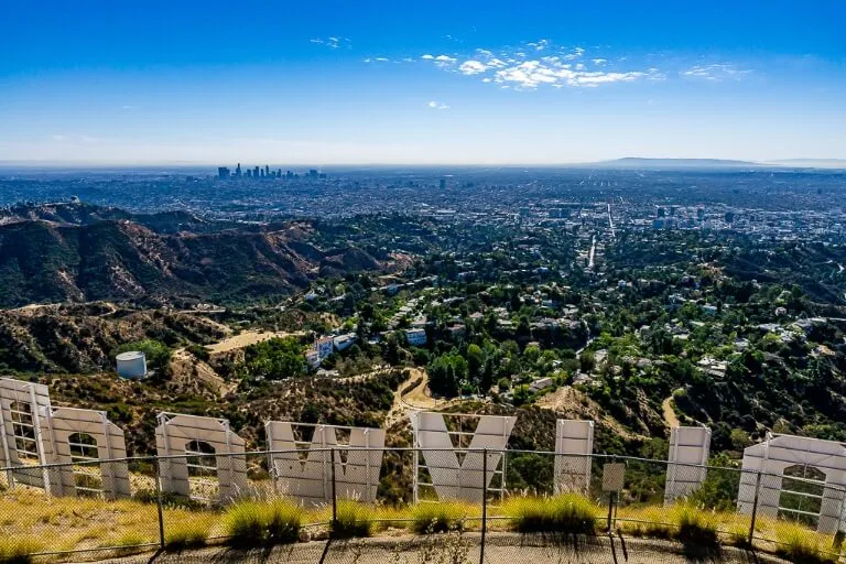 Los Angeles is the biggest of the 3 cities along California Pacific Coast highway 1 from San Francisco to San Diego Hollywood sign from Mt Lee overlooking LA city amazing view