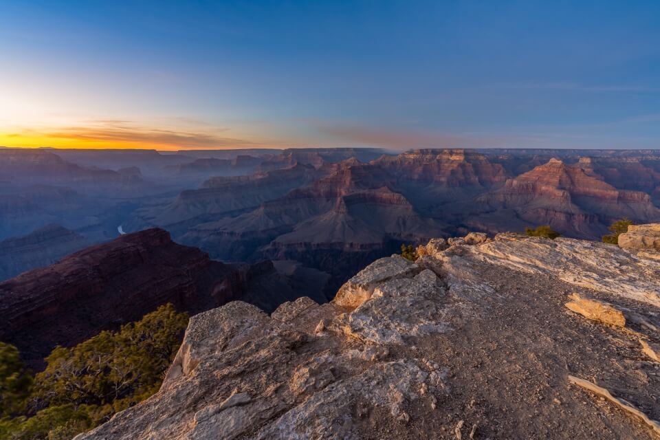 Hopi Point sunset grand canyon south rim spectacular canyon view with orange and yellow sky pink rocks beautiful place to watch the sun setting
