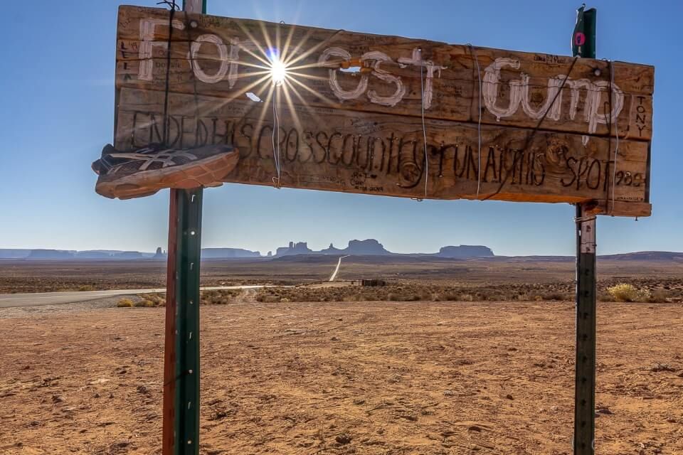 Forrest gump sign at monument valley with starburst on the sun