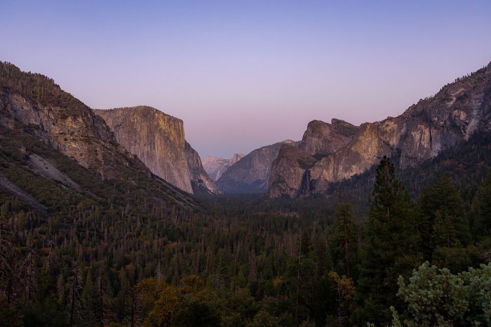 Yosemite national park valley from tunnel view is one of the most famous landscape pictures of america stunning purples at dusk