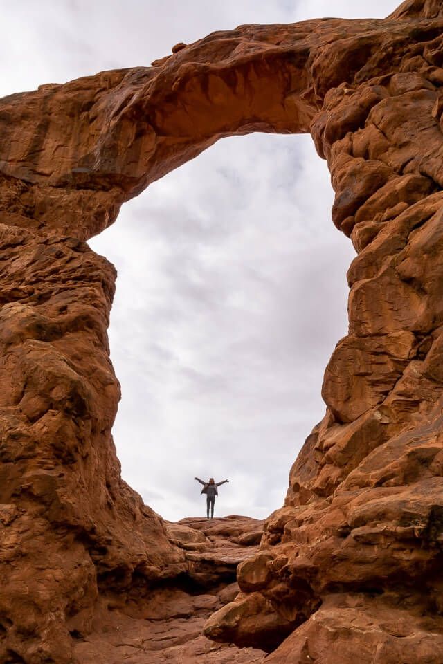 Kristen stood inside the windows arches national park utah usa huge open rounded arch created by erosion