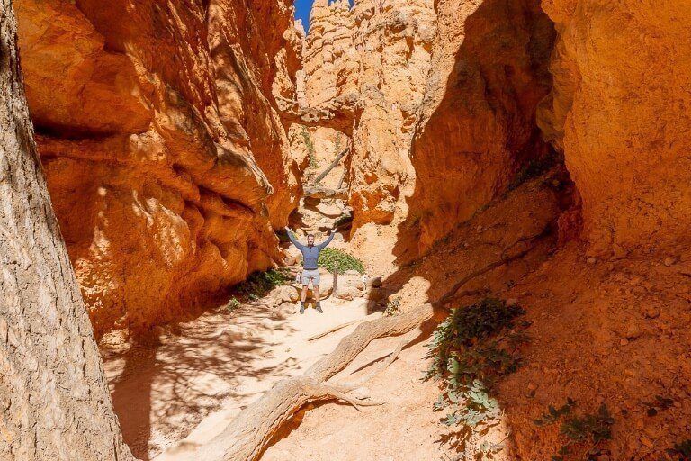 Mark stood underneath twin bridges on a walk in utah