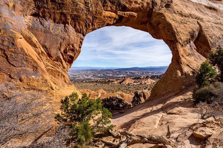 Partition window with an amazing view through the keyhole orange sandstone rocks in utah