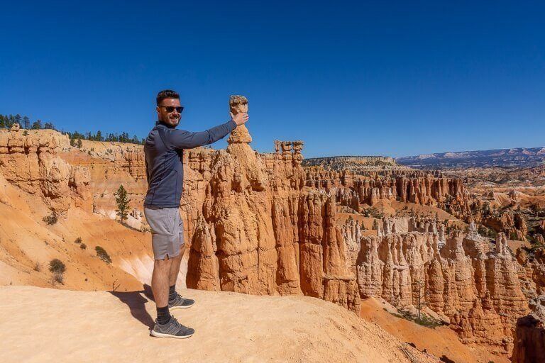 Mark grabbing Thor's hammer to see if he is worthy in bryce canyon national park utah
