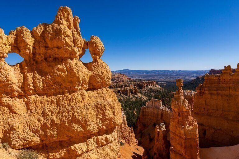 Mask and Thor's Hammer inside sandstone amphitheater in utah