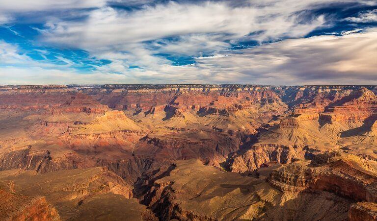 Yavapai Point in late afternoon before sunset at the grand canyon south rim with stunning contrast against the sky and clouds